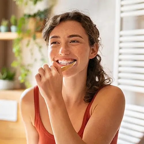 Woman brushing her teeth